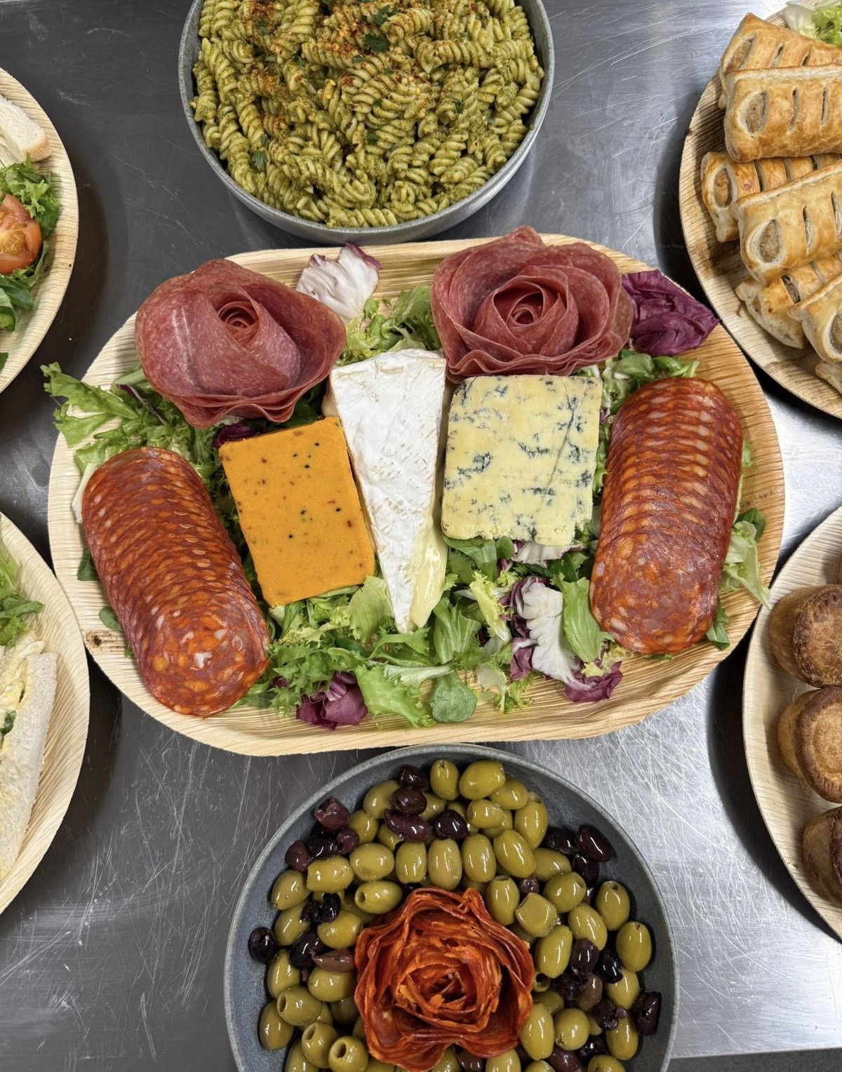 A premium Beast Buffet spread with cured meats, cheeses, olives and homemade sides